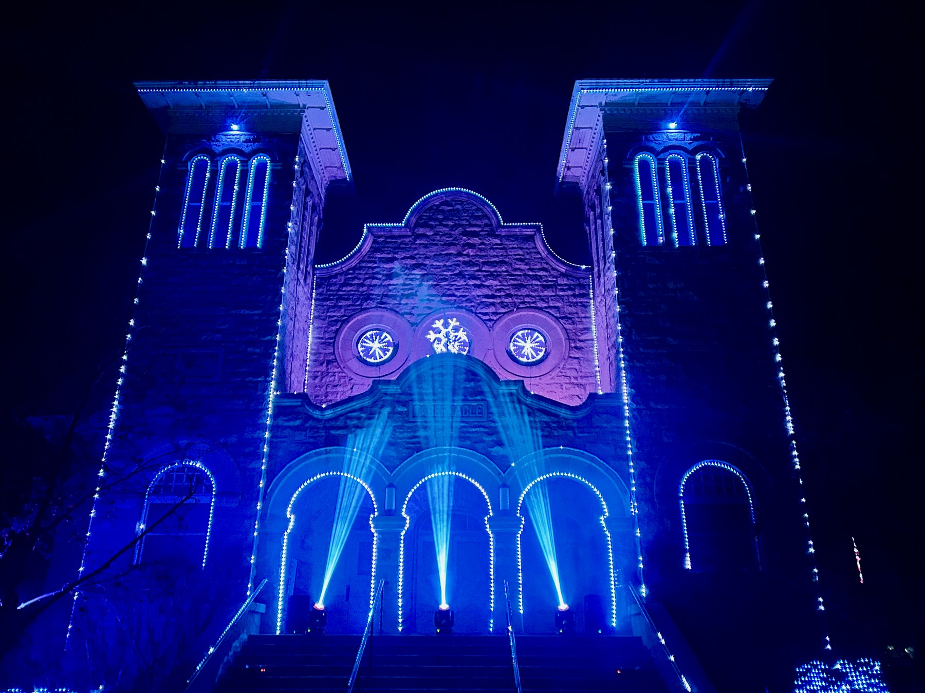 The Rexburg Tabernacle illuminated in vivid blue during the 2023 Christmas display.